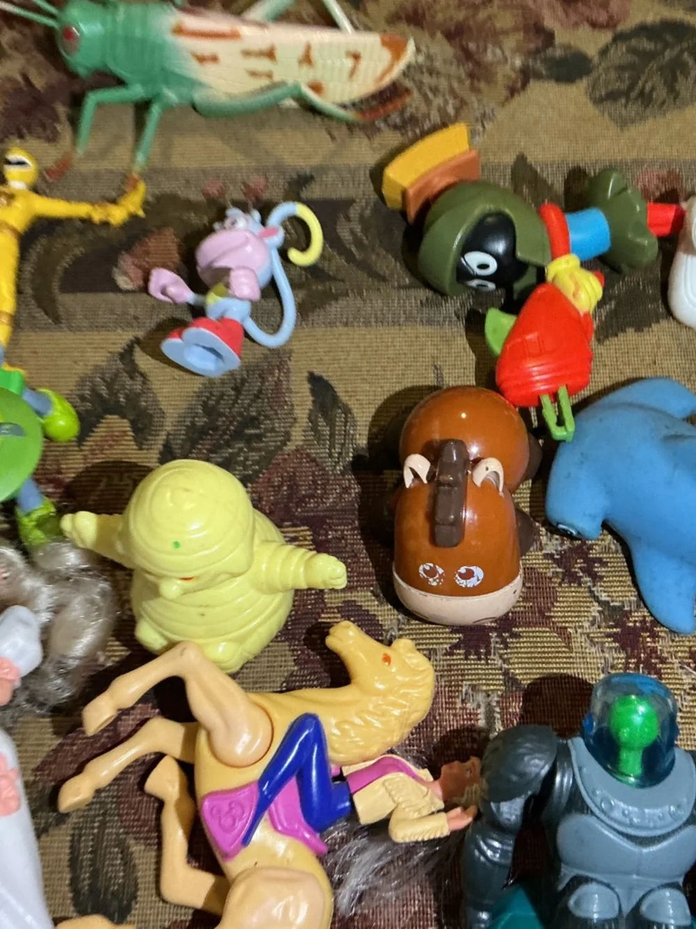 32 Miscellaneous small Toy lot with NBA Bionicle looney tune barbie and more